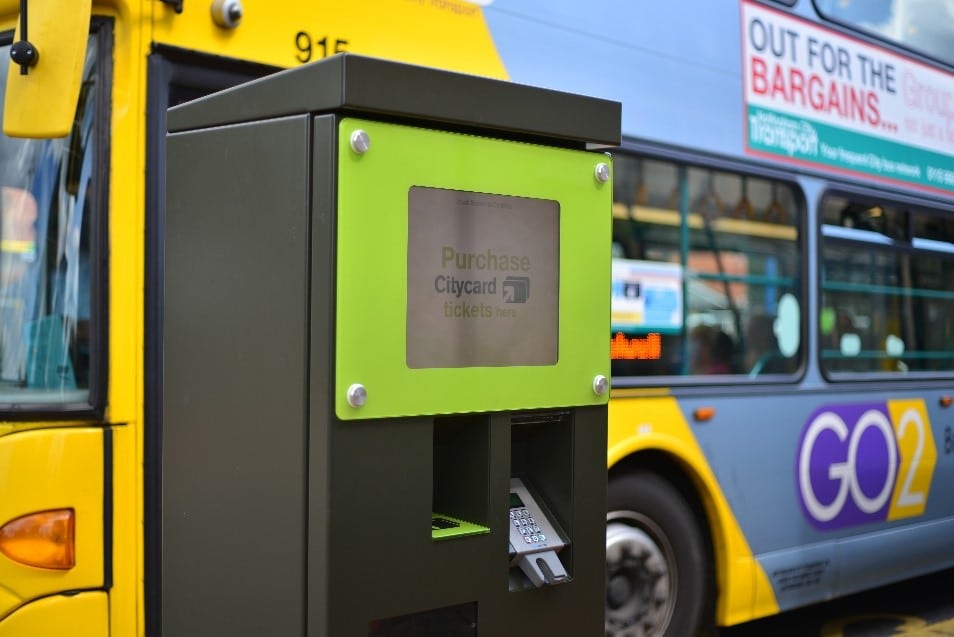 Ticket Vending Machine beside a parked Nottingham City Transport bus