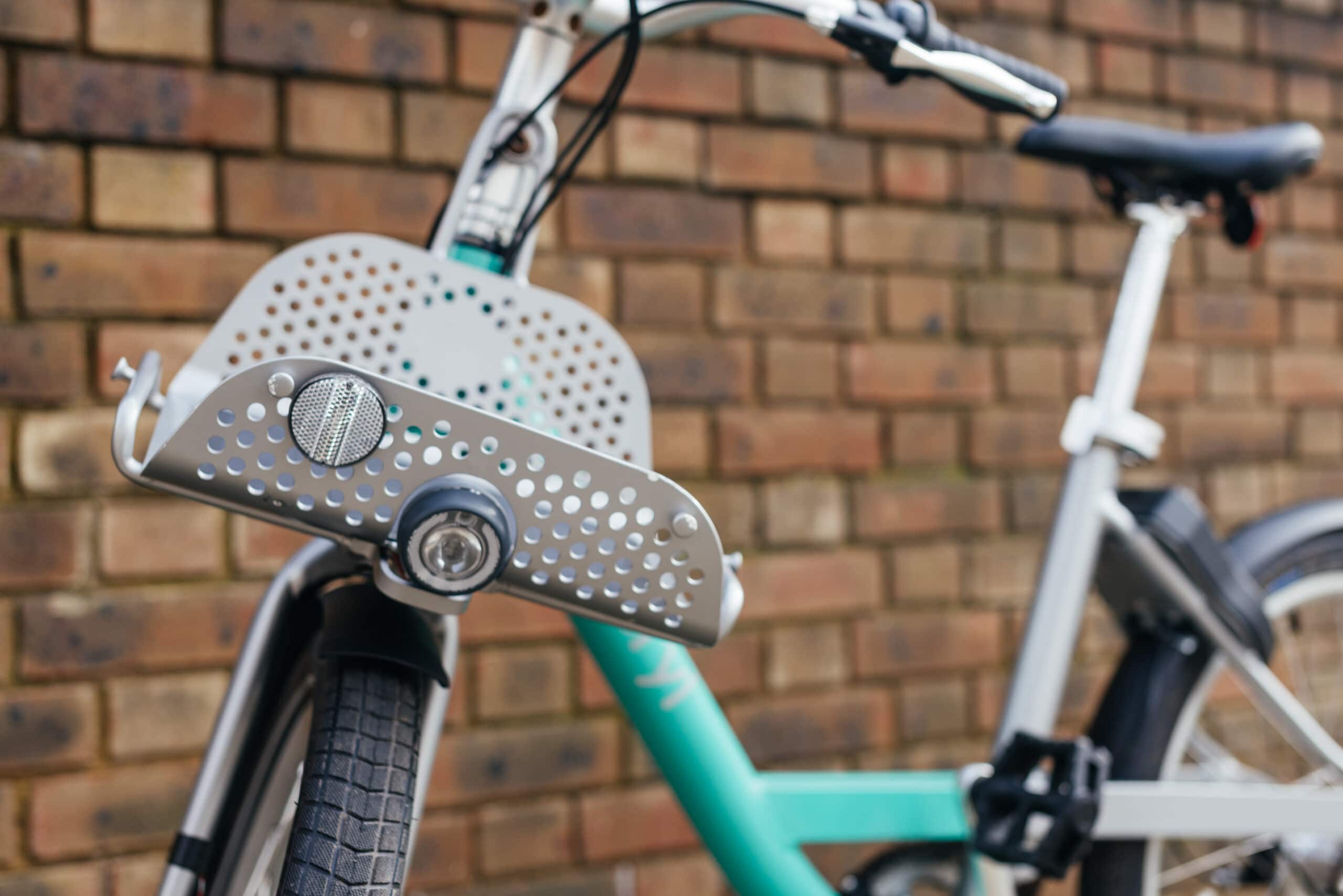 Beryl Bike close up against a brick wall