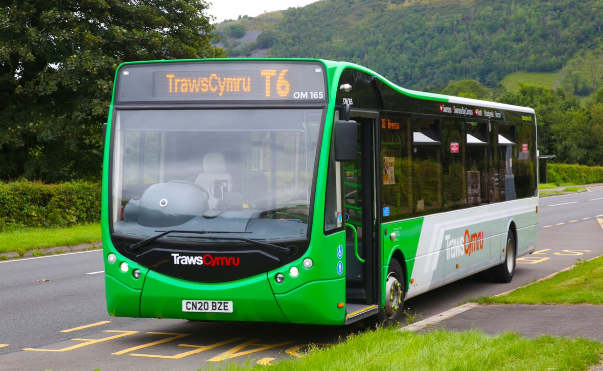 Green Traws Cymru bus on a Welsh country lane