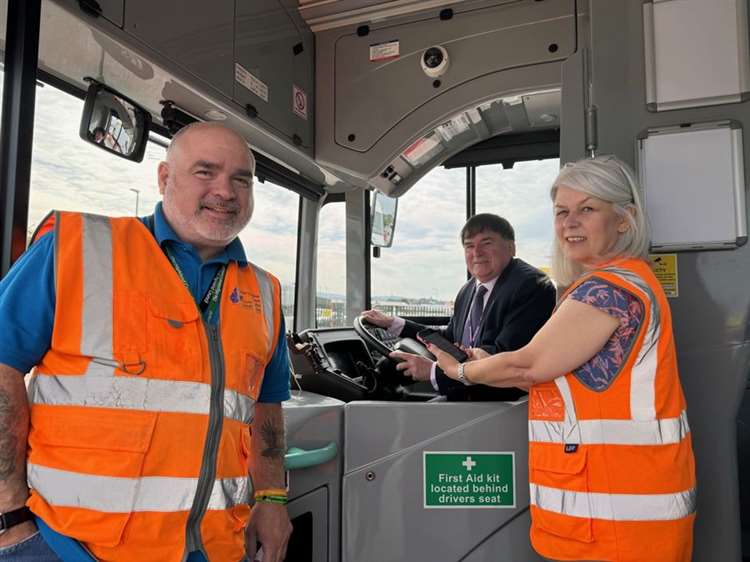 Highlands Council staff with Councillor Ken Gowans on board a bus.