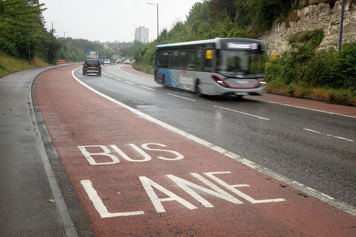 Close up of a bus lane with a Fastrack bus on the other side of the road