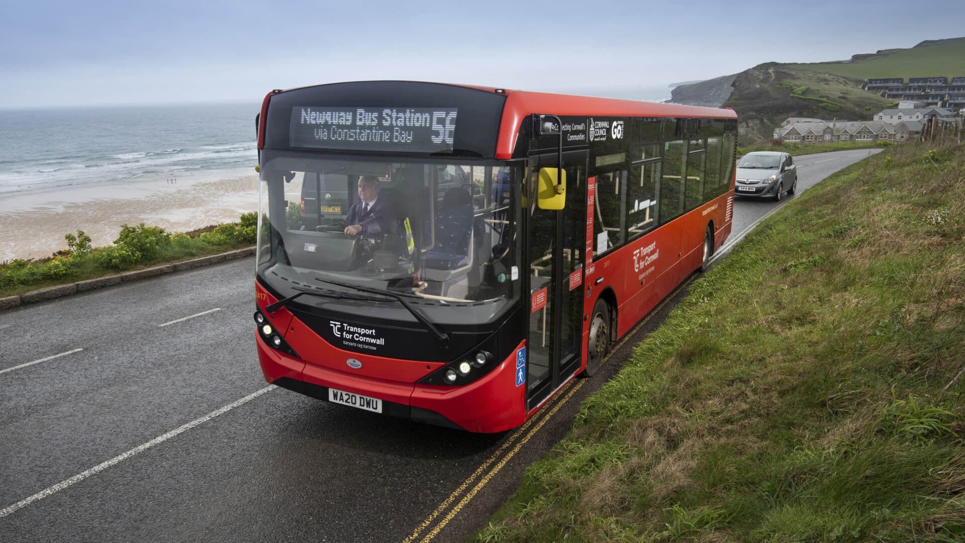 Transport for Cornwall bus (operated by Go Cornwall Bus) on the Newquay 11 route, with the coastline in the background.