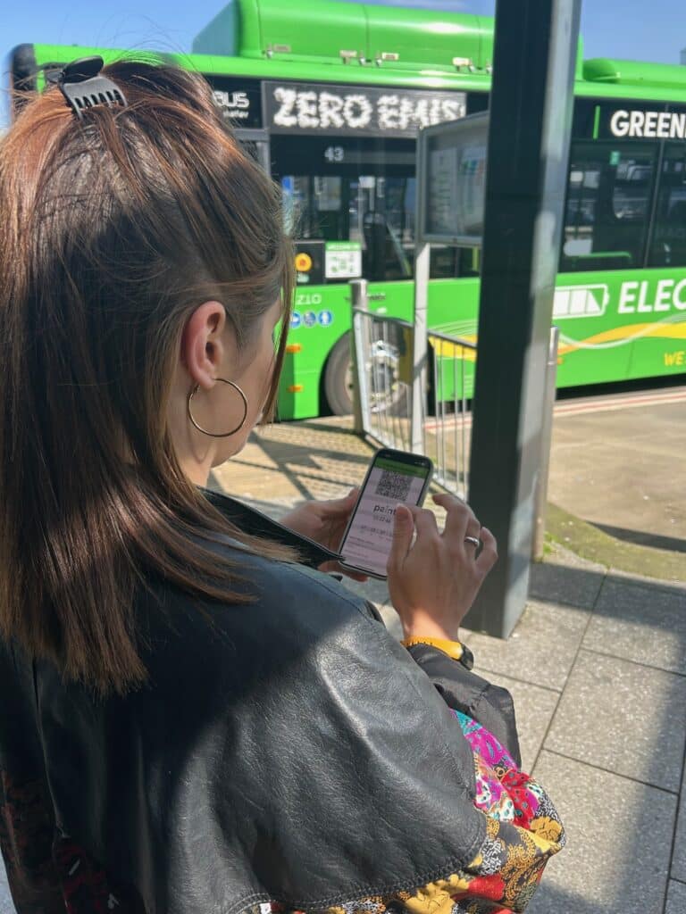 Gemma has the mobile ticket ready to scan in the Newport Bus app at Newport Bus Station